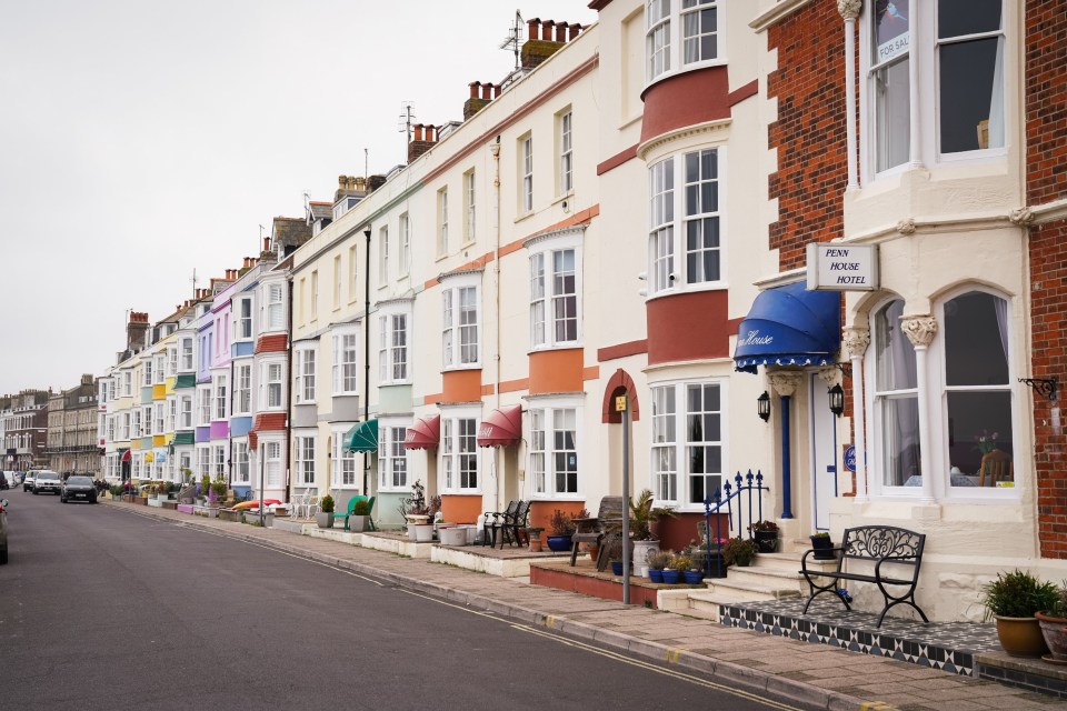 Row of colorful houses on a street.