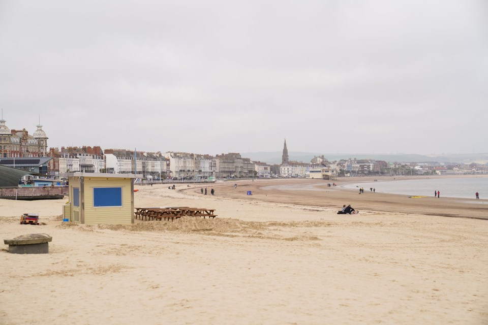 Weymouth beach with buildings in the background.