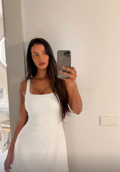 Maya Jama selfie in a white dress.
