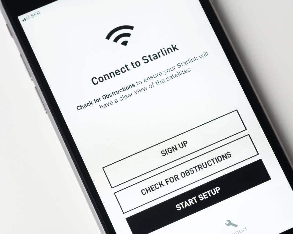 Starlink app on iPhone screen showing connection setup.