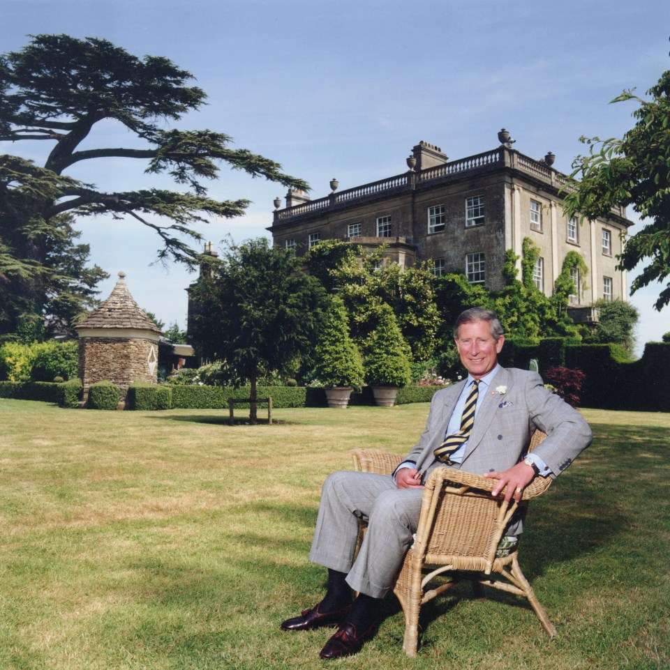 Prince Charles sitting in a wicker chair at Highgrove.