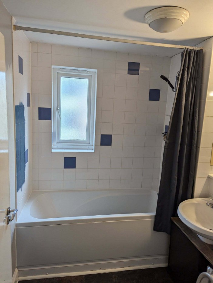 Bathroom with bathtub undergoing renovation.