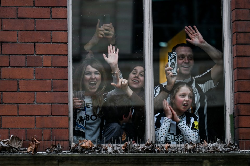 NEWCASTLE UPON TYNE, ENGLAND - MARCH 29: Newcastle fans celebrate during the Newcastle United trophy parade and celebration on March 29, 2025 in Newcastle upon Tyne, England. Newcastle United defeated Liverpool in the Carabao Cup Final to end their seventy-year domestic trophy drought. (Photo by Serena Taylor/Newcastle United via Getty Images)