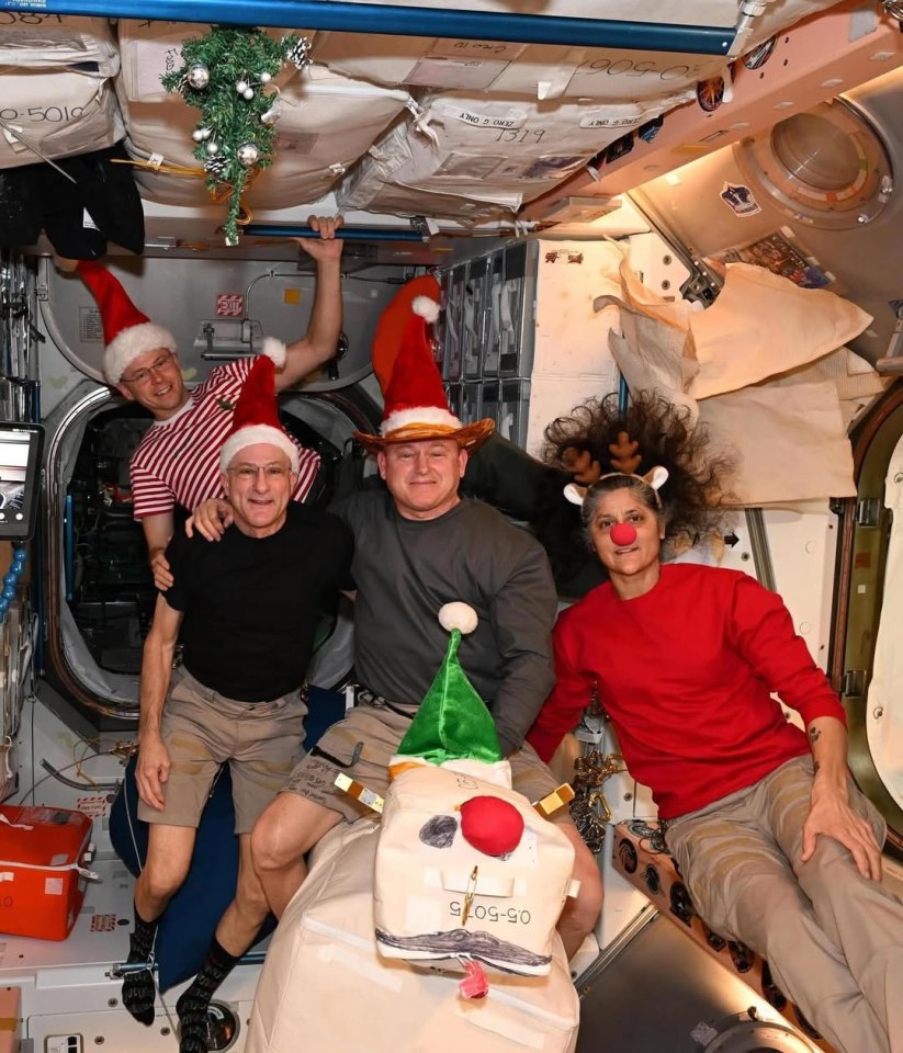 Astronauts celebrating Christmas on the International Space Station.