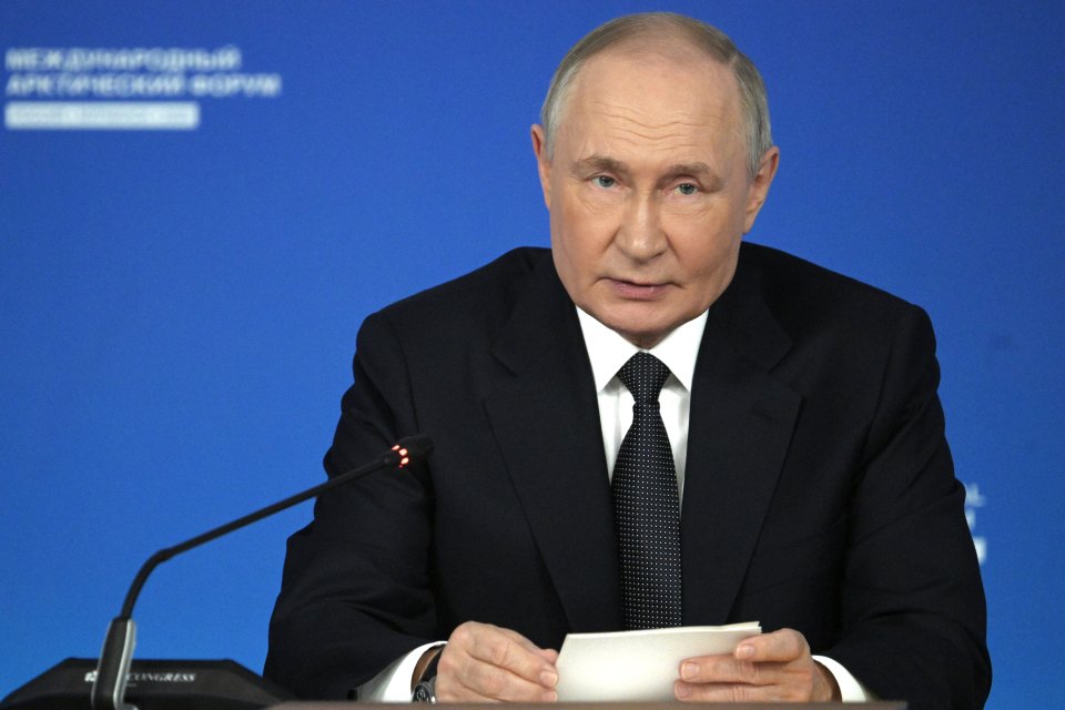 Vladimir Putin speaking at a meeting.