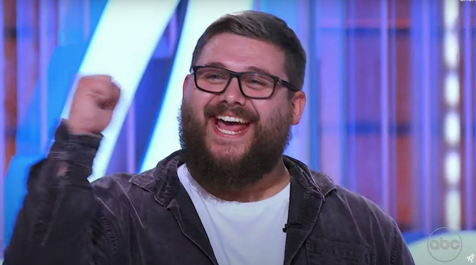 Screenshot of a man celebrating.