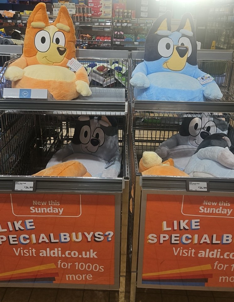 Four plush character chairs on display in a store.