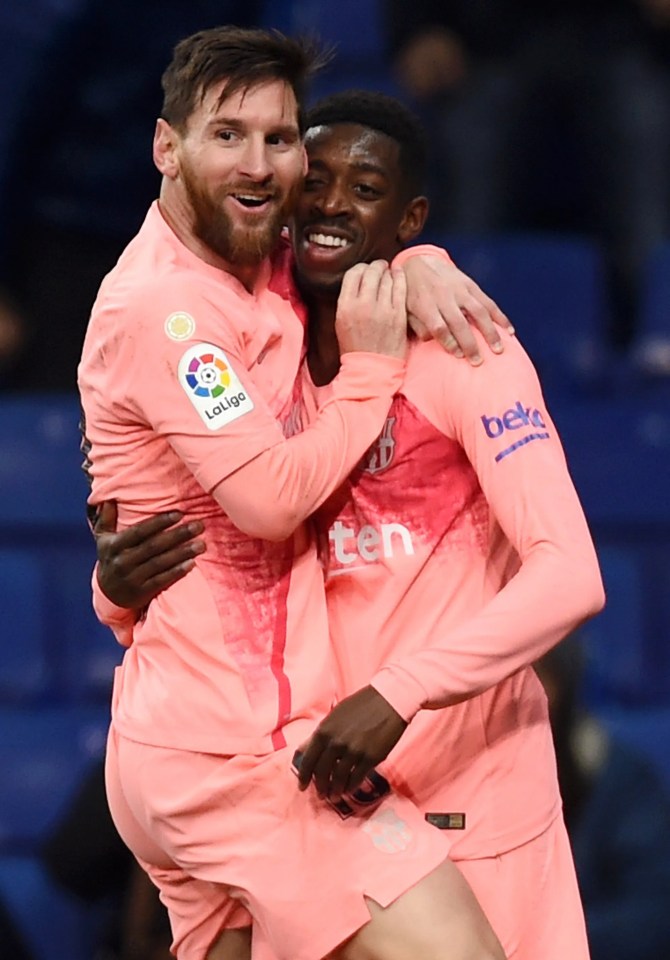 Ousmane Dembélé and Lionel Messi celebrating a goal.