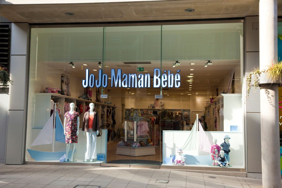 JoJo Maman Bébé storefront with mannequins and children's clothing.