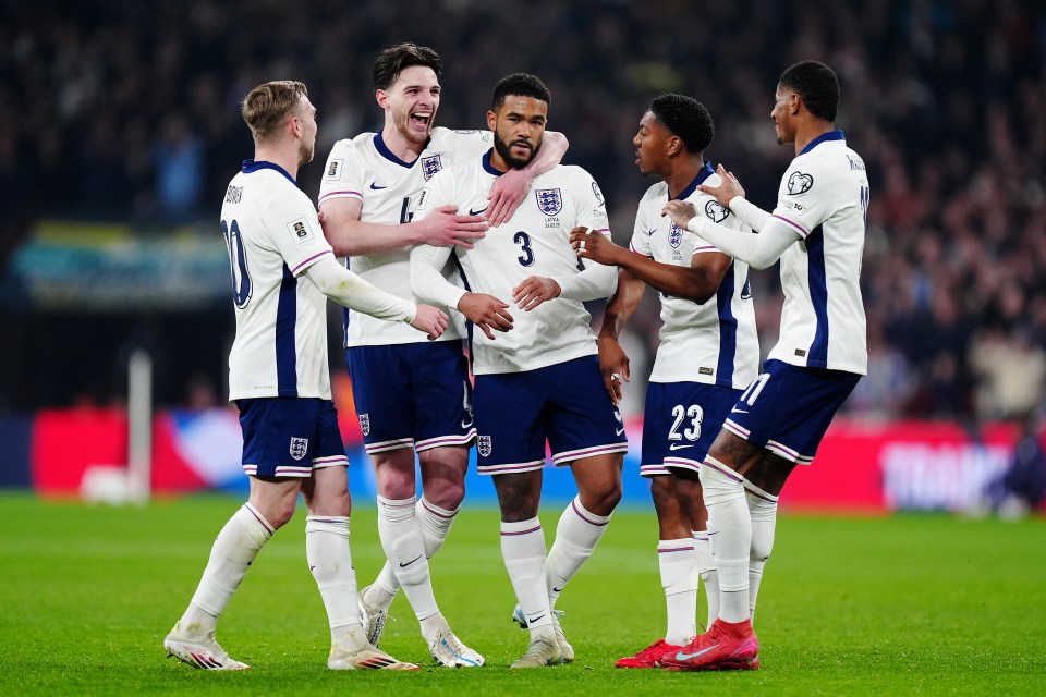 England soccer players celebrating a goal.