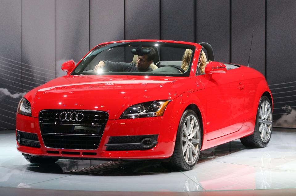 Red Audi TT Roadster at auto show.