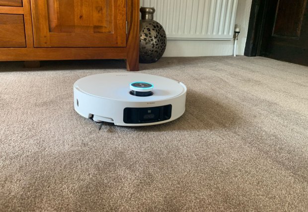 Dreame X50 Ultra robot vacuum on carpet.
