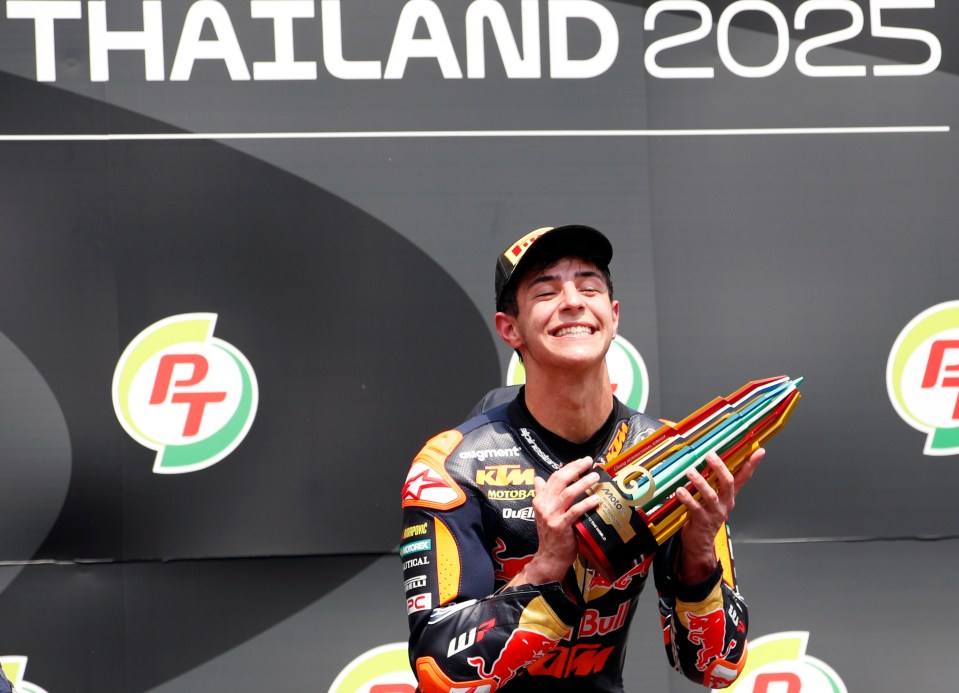 Jose Antonio Rueda celebrates on the podium at the Moto3 race in Thailand.