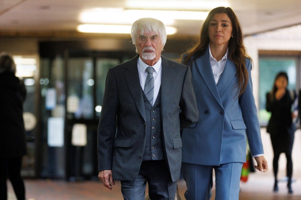 Bernie Ecclestone and a woman leaving Southwark Crown Court.