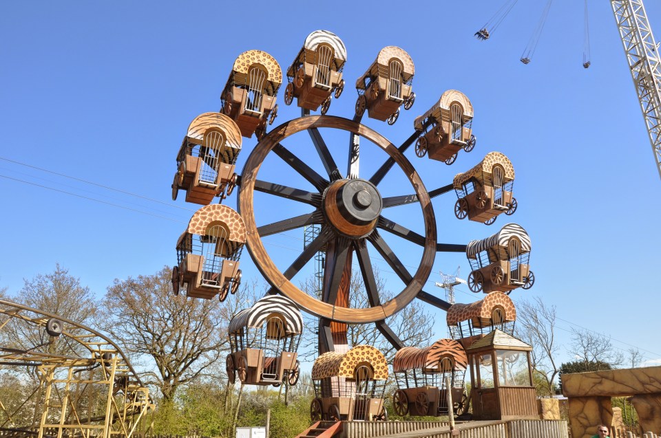 Ferris wheel with animal-print carriages.