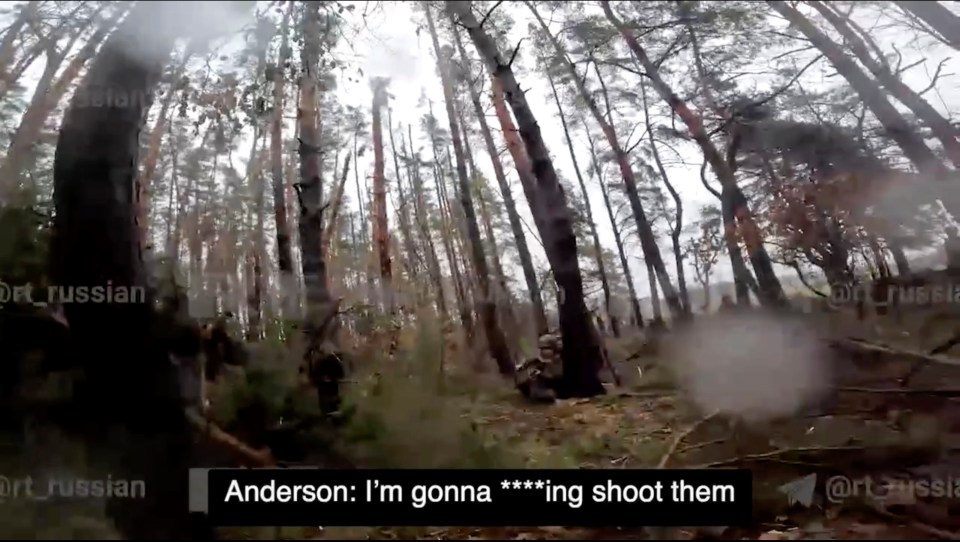 Footage of a soldier threatening to shoot approaching Russian troops.