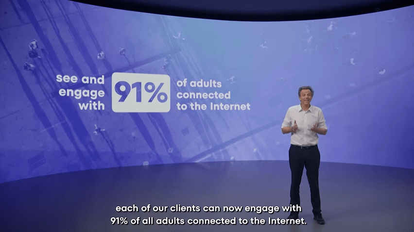 Man presenting data showing 91% of adults are connected to the internet.