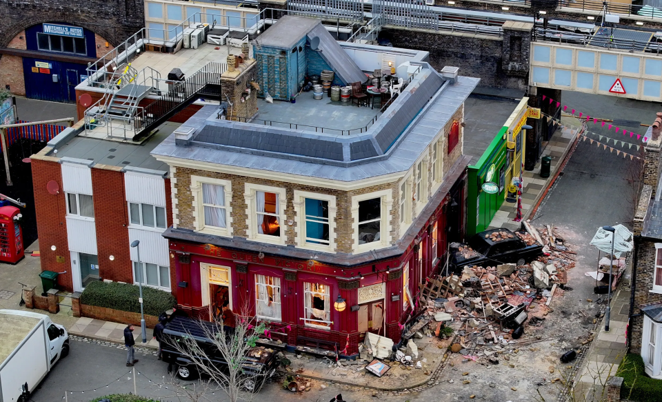 Aerial view of the Queen Victoria pub set after a staged explosion.