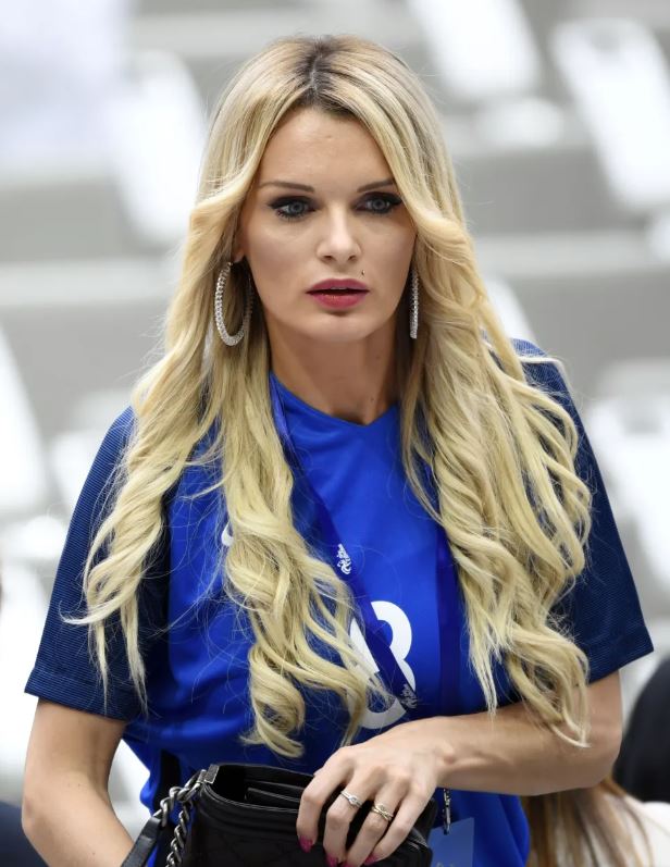 Ludivine, blonde woman in blue shirt.