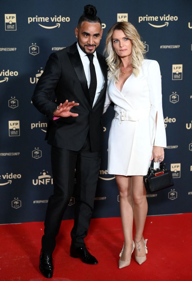 Dimitri Payet and his wife at an awards ceremony.