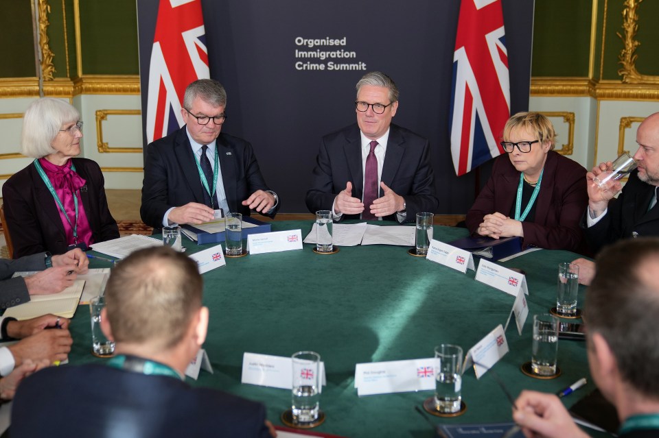 Prime Minister Keir Starmer leading a roundtable discussion at the Organised Immigration Crime Summit.