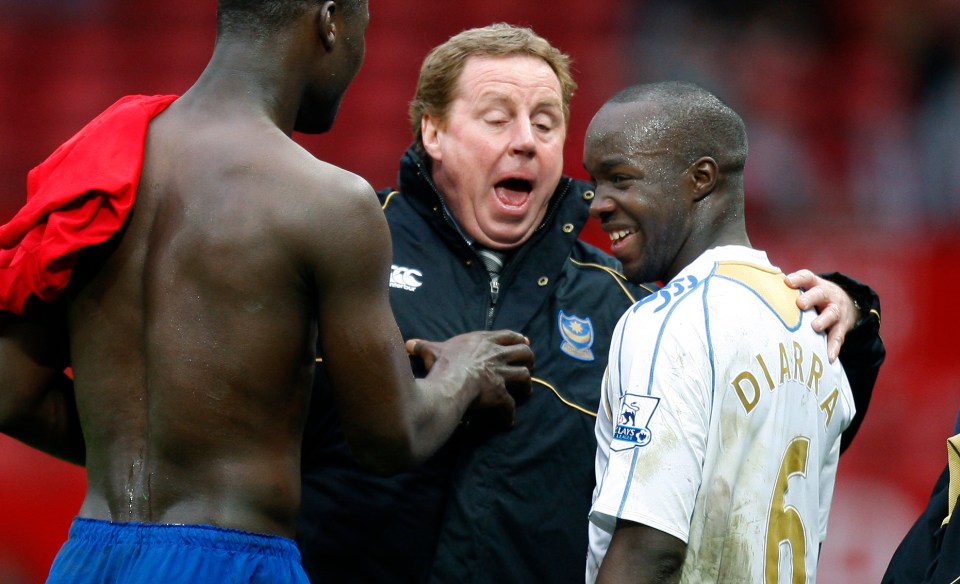 Harry Redknapp congratulates Portsmouth players after a 1-0 FA Cup win.