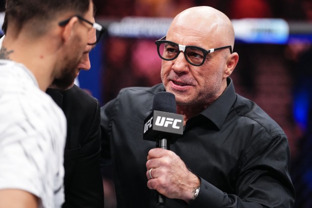 Joe Rogan interviewing a fighter at a UFC event.
