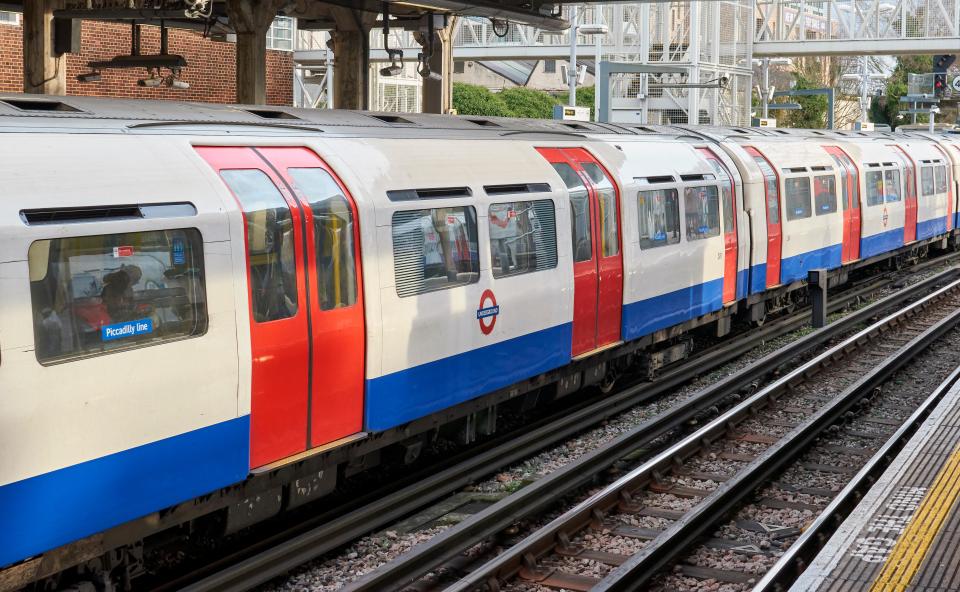 London Underground train arriving at a station.