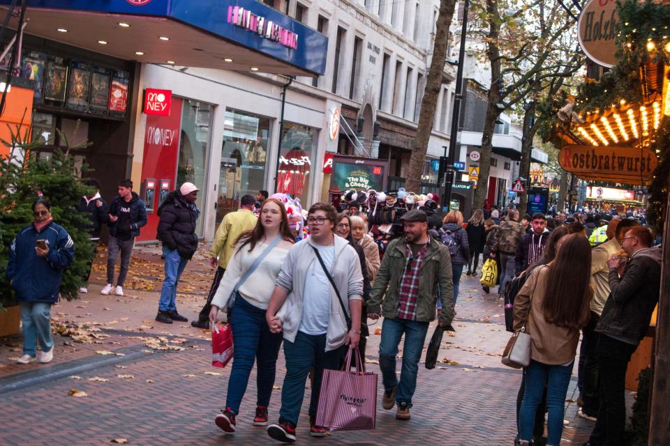 Shoppers in Birmingham city centre enjoying Black Friday deals.