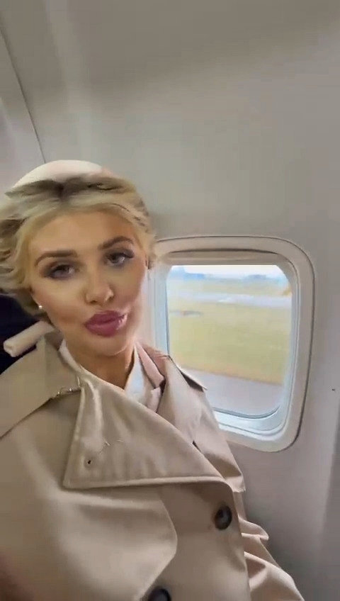 Video grab of a woman pretending to be pregnant on a plane.