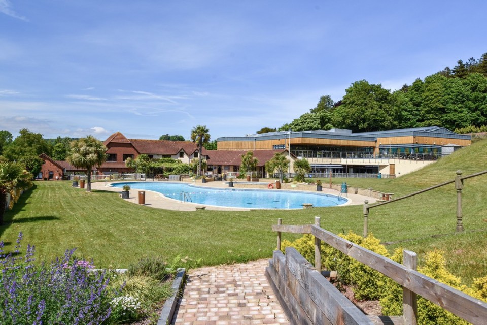Outdoor pool at Cofton Holiday Park in Devon.