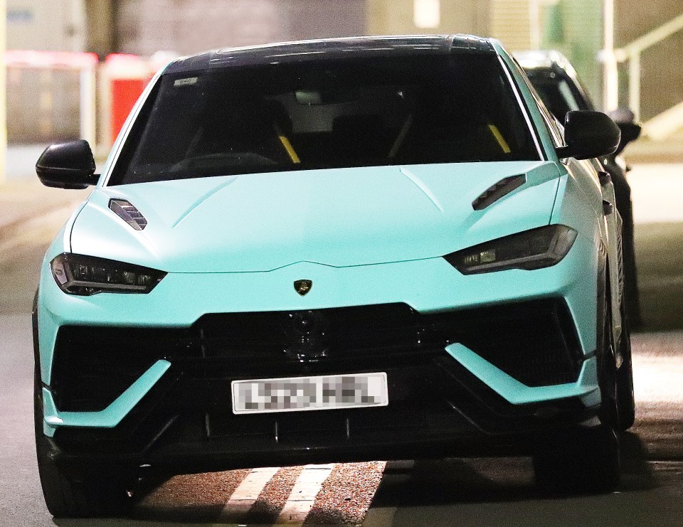 Jack Grealish's light blue Lamborghini Urus parked on double yellow lines.