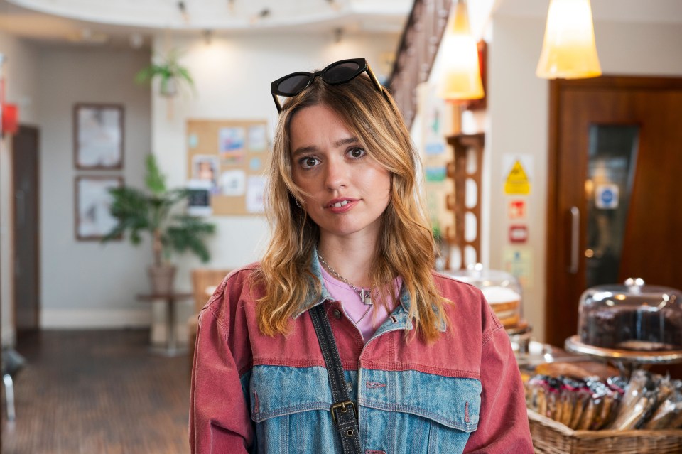 Aimee Lou Wood in a red and denim jacket.
