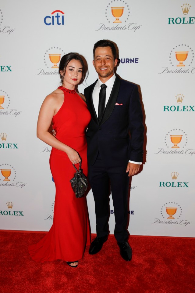MELBOURNE, AUSTRALIA - DECEMBER 10: U.S. Team's Xander Schauffele and partner, Maya Lowe, walk the red carpet prior to Presidents Cup at The Royal Melbourne Golf Club on December 10, 2019, in Melbourne, Australia. (Photo by Con Chronis/PGA TOUR via Getty Images)