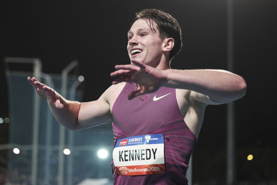 Lachlan Kennedy celebrating after winning the men's 200m event.
