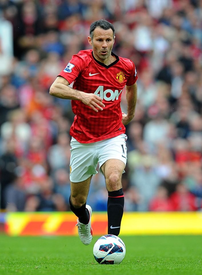 Ryan Giggs in Manchester United uniform playing soccer.
