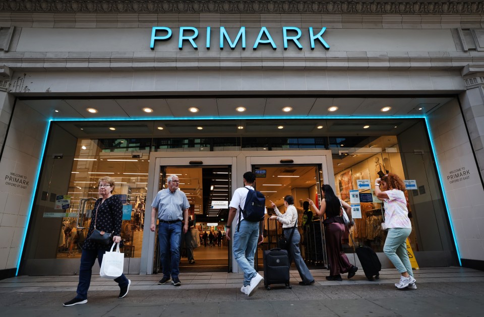 People entering and exiting a Primark store in London.