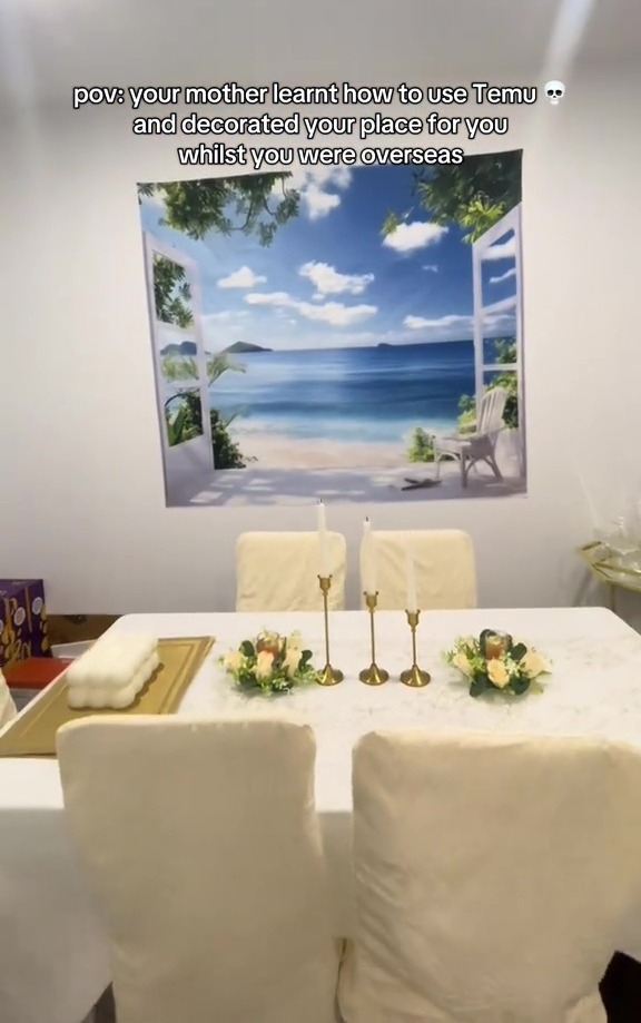 A dining table set with beach-themed wall art.