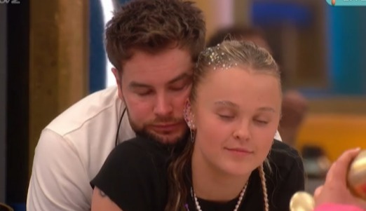 Chris Hughes embracing JoJo Siwa.