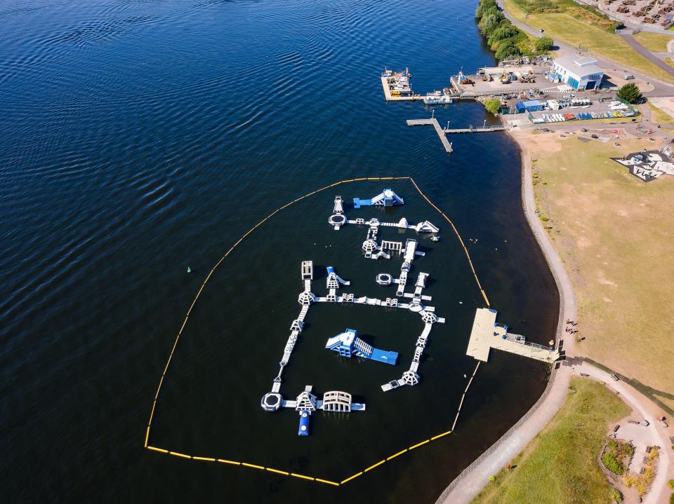 Aerial view of an inflatable aqua park in Cardiff Bay.