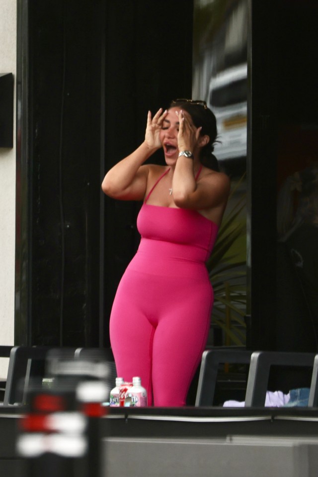 Chloe Brockett looking upset in pink outfit.