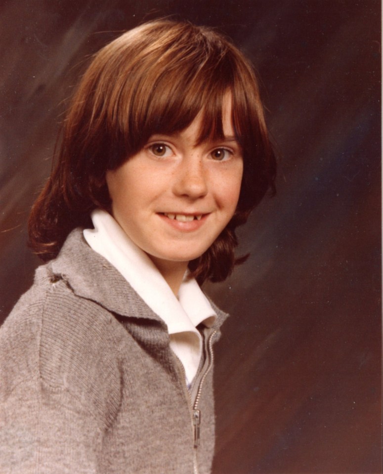 Photo of a young girl with shoulder-length brown hair.