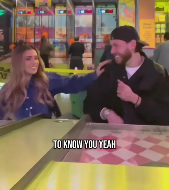 Two Love Island stars at an arcade.