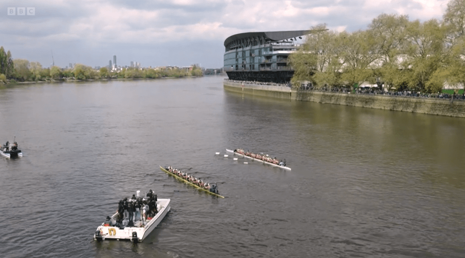 Suspended boat race on a river.