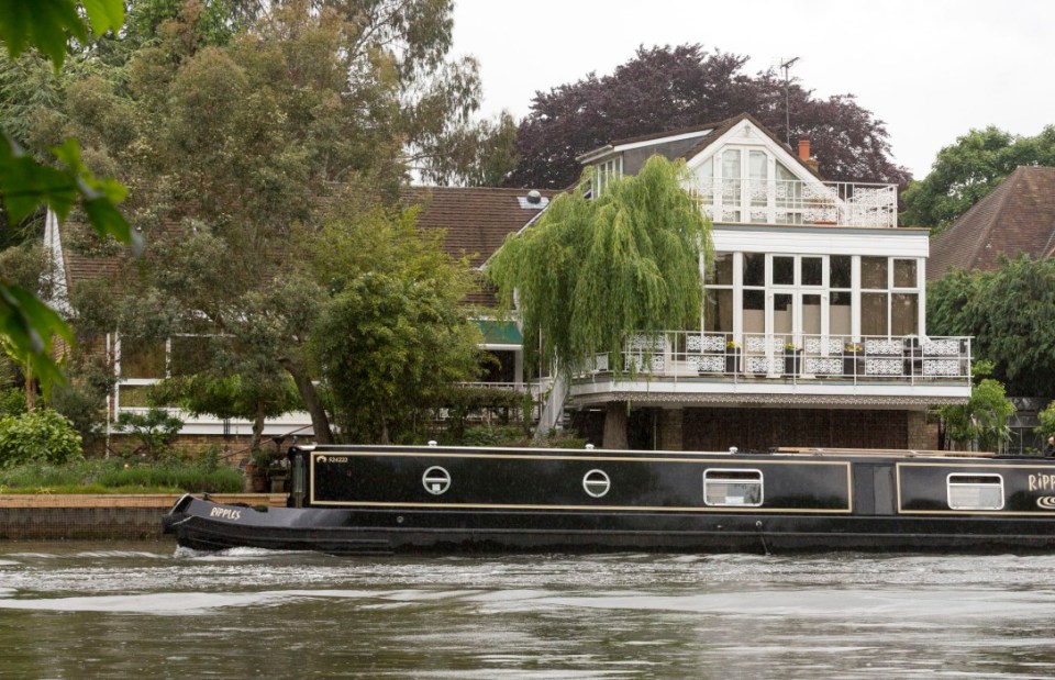 Pic Doug Seeburg - The rear of Rolf Harris's Bray house on the river Thames where white screens were put up at the windows before he arrived back fro Stafford prison.