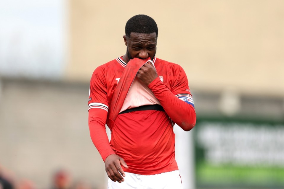MORECAMBE, ENGLAND - APRIL 21: Yann Songo'o, captain of Morecambe reacts after the final whistle with relegation confirmed during the Sky Bet League Two match between Morecambe and Salford City at Mazuma Stadium on April 21, 2025 in Morecambe, England. (Photo by Jan Kruger/Getty Images)