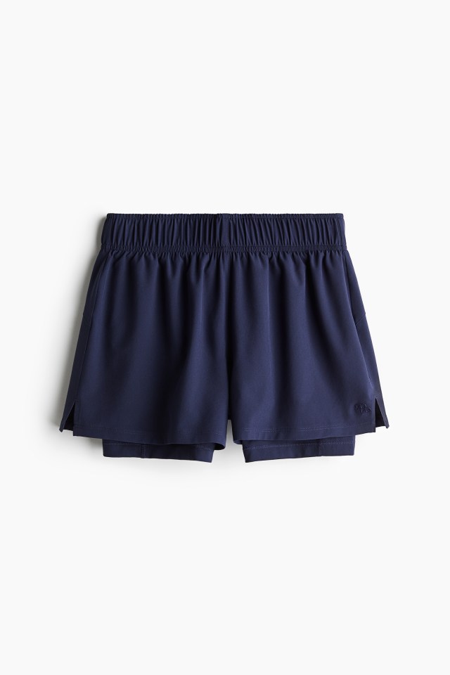 Double-layered navy blue running shorts.