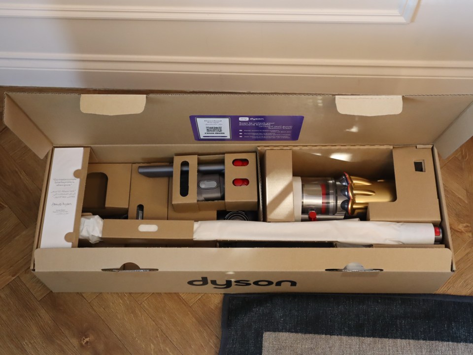 The Dyson V12 Detect Slim Absolute in its box