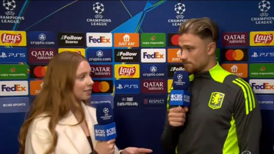 A reporter interviewing a soccer player.
