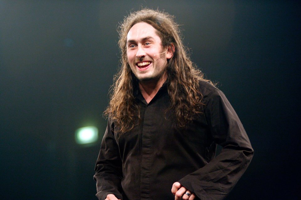 Ross Noble performing on stage.
